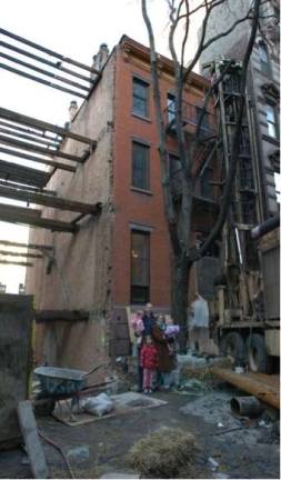 A GREEN DREAM DEFERRED Colin Rath and his family in front of 121 West 15th St. 