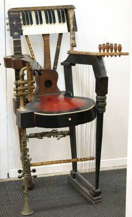 the people’s auction A hand-crafted chair, made from parts of various musical instrument parts, sold for $225, a bargain, according to some. Photo courtesy Showplace Antique + Design