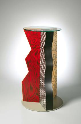 A Design Visionary Ettore Sottsass (Italian, 1917-2007). "Ivory Table," 1985. Formica, wood, glass. H. 39-3/4 x Dia. 24 in. b: Glass top; Dia.19-1/2 x Thickness 1/4 in. The Metropolitan Museum of Art, Gift of Dr. Michael Sze, 2002 © Studio Ettore Sottsass Srl