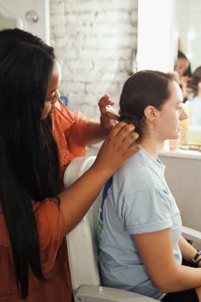 Helmet hair: Biking styles for women Stylist works on GWC member Lucy Robson's do. Photo: Ryan Segedi  