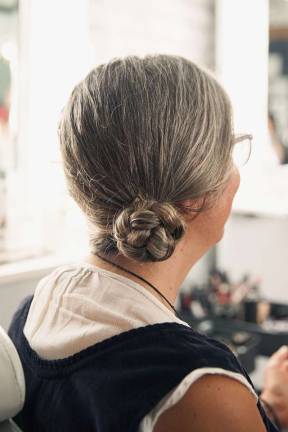 Helmet hair: Biking styles for women GWC member Michelle Novie sports a braided low side bun. Photo: Ryan Segedi