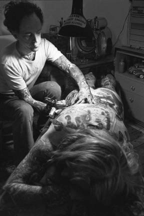 skin deep John Wyatt (b. 1942). Thom de Vita and client in his studio at 326 East Fourth Street, 1976. Gelatin silver print. Courtesy of the artist