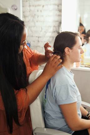 Helmet hair: Biking styles for women Stylist works on GWC member Lucy Robson's do. Photo: Ryan Segedi  
