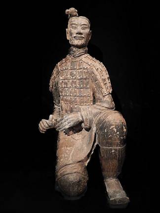 ancient china unearthed A kneeling archer from China's famed Terracotta Army still bears traces of the bright pigments that once decorated his armor. Photo: Adel Gorgy