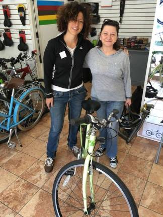 GOOD REASON FOR A BAD HAIR DAY Angela Azzolino (left) with Gina, a GWC member, after a few test rides. Photo: GWC