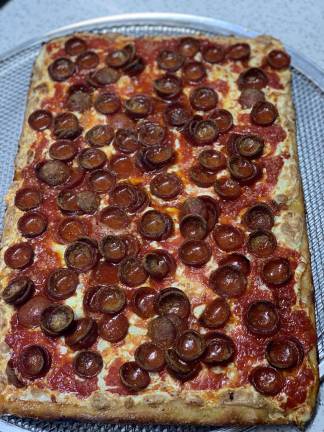 a manhattan pizza war The pizza in question. Photo courtesy Made in New York Pizza