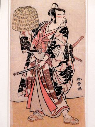 Weaving a Tale "Kabuki Actor Ichikawa Danjuro V" carries a bamboo helmet in this 1774 woodblock print. Photo: Adel Gorgy