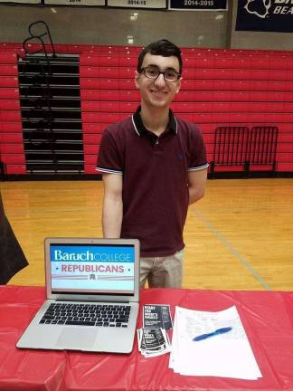 COLLEGE REPUBLICANS STAKE CLAIM Vincent Gangemi, president of the Baruch College Republicans, at the Baruch College Transfer Student Organization's Club Fair. Photo: Baruch College Republicans