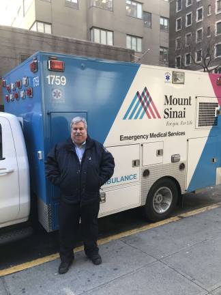 the singsong of the siren Joseph J. Davis, the director of Emergency Medical Services for the Mount Sinai hospital system, stands in front of one of the two dozen ambulances he oversees in a recent photo at Mount Sinai West on West 59th Street. Photo: Mount Sinai Health System