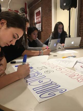 City teens seize the moment Members of Coalition Z, a political action group founded by three students from The Dalton School, made protest signs in opposition to cabinet appointments and executive orders that have defined the first weeks of President Donald Trump's tenure. Photo: Zoe Davidson