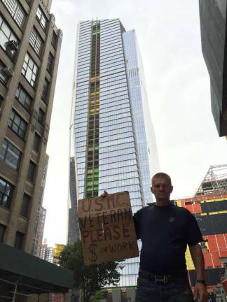 living in a valley of glass Larry Martin, who has lived for two years in a makeshift tent on West 31st Street near 10th Avenue, in the shadow of the ongoing Hudson Yards megadevelopment project. Photo: Isidro Camacho