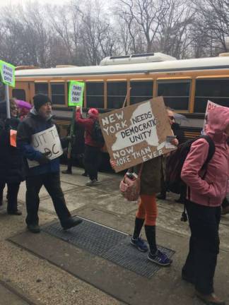 “Which side are you on?” Protesting outside Alcantara's office in Washington Heights. Photo: Madeleine Thompson  
