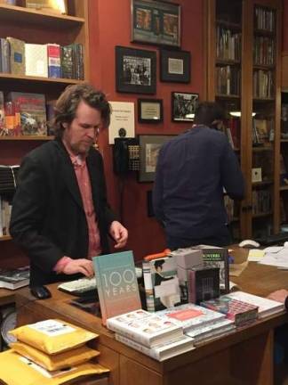 Farewell to a beloved bookstore Bookstore manager Thomas Talbot was on duty during the closing party at Crawford Doyle Booksellers. Photo: Christopher Moore