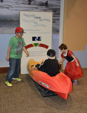 native innovation for the next generation Fifth-grade students from New York City Public School 276 try out a kayak balancing activity at the imagiNATIONS Activity Center grand opening ceremony on Thursday, May 17, 2018. Photo: Jason DeCrow/AP Images for Smithsonian's National Museum of the American Indian 