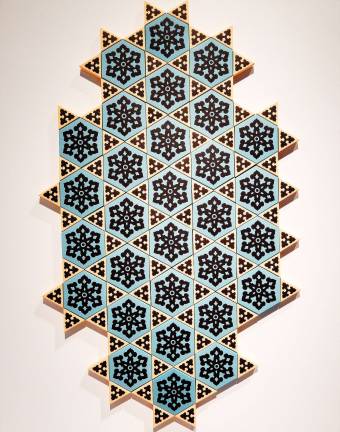 Now Art Belongs to You and Me Paper cutouts become tiles, Stars of David, or anything the viewer wants to make of them in "It Is He Who Created You From A Single Soul" by Dana Awartani. Photo: Adel Gorgy