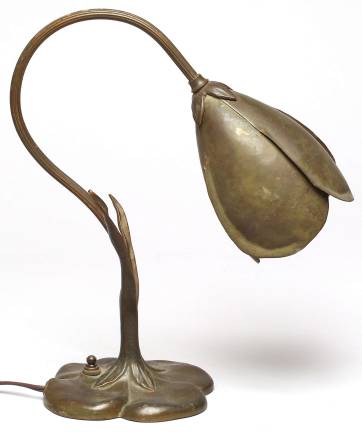 the people’s auction Bronzed "Crocus" lamp, ca. 1935, by the American illustrator and designer McClelland Barclay, was given an estimated value of $200-400 but created a bidding war, finally selling for $650 at a recent Showplace Antique + Design auction on West 25th Street. Photo courtesy Showplace Antique + Design