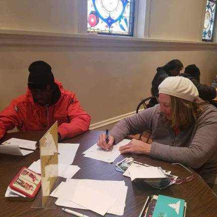 The Writing Den helps people in need connect Guests of Holy Apostles Soup Kitchen, at the November “den.” Photo: Jill Higson