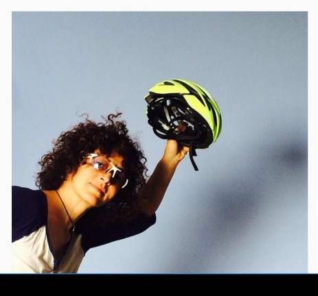 Helmet hair: Biking styles for women Angela Azzolino tips her helmet. Photo: GWC