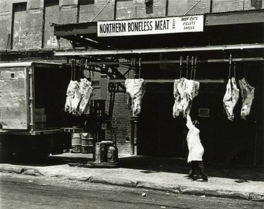Meatpacking mecca packs in history history A worker hauls product from a Meatpacking District purveyor on Washington Street into a waiting truck in this photograph by Eugene Gordon. Photo courtesy of New-York Historical Society.