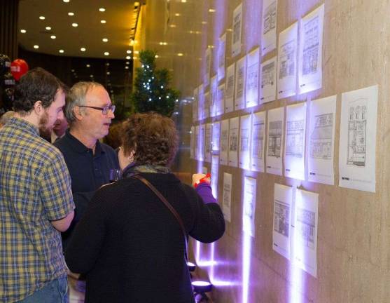 45 years and counting event honors our town, east side businesses East side business owners looking over the sketches that appeared in the newspaper last year. Photos by George Cade