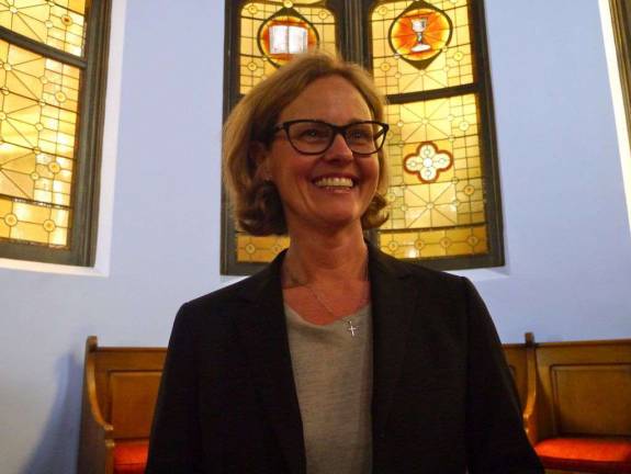 The Rev. Beverly Dempsey, pictured in the sanctuary of Jan Hus Presbyterian Church, will be installed as pastor and head of staff of the church and Neighborhood House on Sunday. Photo by William Mathis.