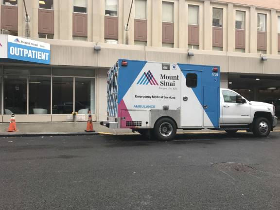 the singsong of the siren An ambulance on West 59th Street between Ninth Avenue and Tenth Avenue after transporting a patient to the emergency room of Mount Sinai West on Sunday, February 4th. Photo: Douglas Feiden 