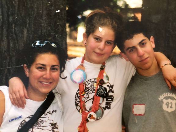 Siblings at Walden. Caroline Rothstein (left) as a counselor, with her sister Natalie as a camper and their brother Josh on visiting day in 2002. Photo: Courtesy of Caroline Rothstein