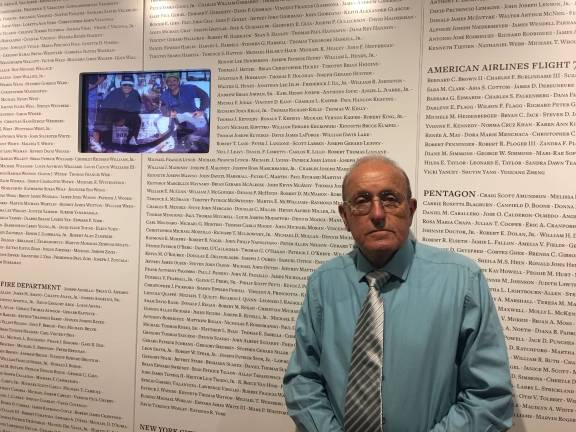 9/11 Tribute Center reopens Lee Ielpi, a retired firefighter and co-founder of the 9/11 Tribute Center, stands in front of a wall listing the name every victim, including his son Jonathan. The center reopened in a new location on June 7. Photo: Madeleine Thompson