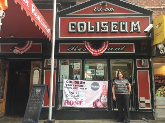 Kathleen Reilly, the owner of The Coliseum, in front of the pub, which is set to close next week. Photo: Michael DeSantis