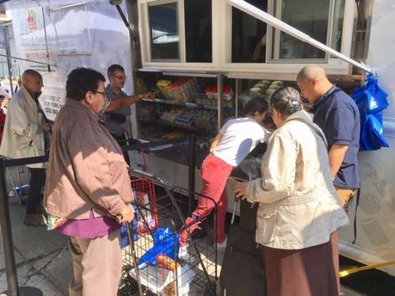 A food pantry on wheels Lincoln Square neighbors try out WSCAH's new mobile pantry. Photo: Leslie Gersing