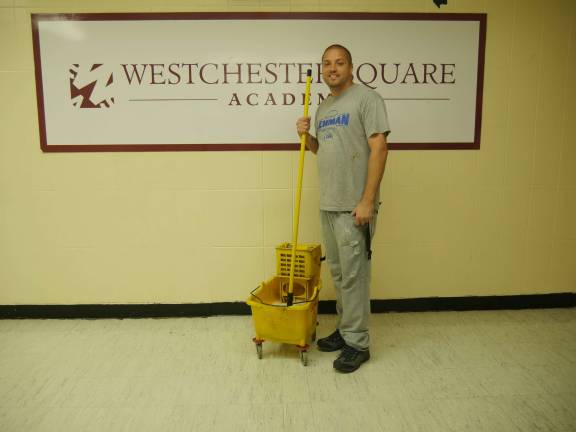 A school’s cornerstone Walter DeJesus, public school cleaner of the year, at the Westchester Square Academy on the Lehman High School campus. Photo: Sarah Stein Kerr