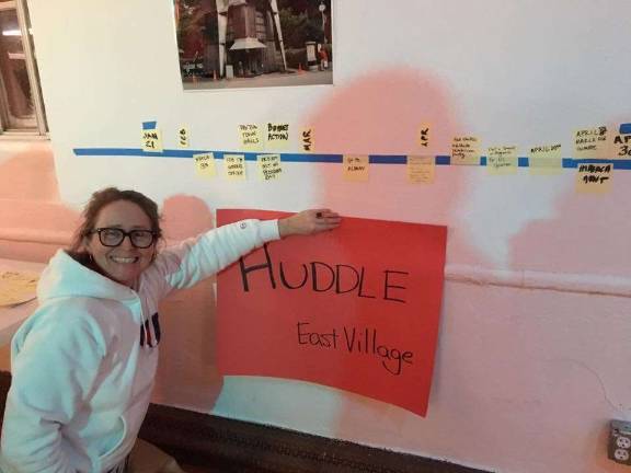 envisioning four years from now Huddle organizer Ulli Barta next to a timeline of actions her group of activists were planning. Photo: Claire Wang  