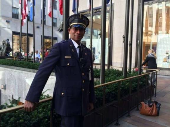 at the brink of the rink Pedro Francisco on duty at Rockefeller Center, where he saved a teenager. Photo: Genia Gould