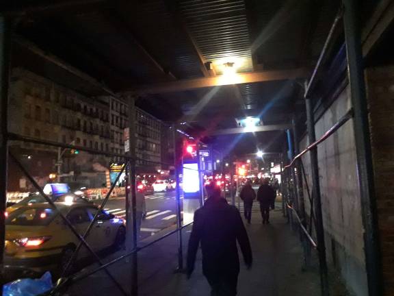 Lighting for the sidewalk shed was added after neighbors advocated for it. Photo: Scott Stiffler