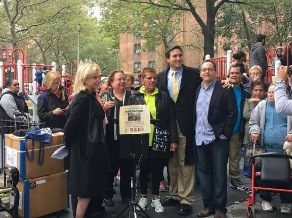 battle over playground at holmes towers Rep. Carolyn Maloney, State Senator Liz Krueger, President of the Holmes Towers Tenant Association Sandra Perez, Council Member Ben Kallos and Executive Director of the Stanley Isaacs Neighborhood Center Greg Morris rallied to save a playground. Photo: Madeleine Thompson.