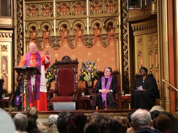 unity and refuge Cardinal Timothy M. Dolan speaks at an interdenominational service at Marble Collegiate Church on March 29. Marble's pastor, Dr. Michael B. Brown, is to Dolan's right. Photo: Michael Garofalo