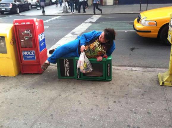 Woman with Fondness for Our Town Downtown Newsboxes Becomes Reddit Fixture