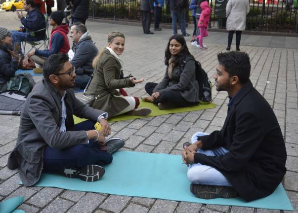 connecting, in person The New York City version of the World’s Biggest Eye Contact Experiment took place at Bowling Green Plaza Saturday morning. Photo: Diamond Naga Siu