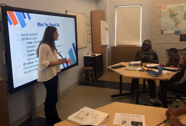 breaking the cycle of poverty Laura Habian, teaching fellow and a junior at Vanderbilt University, teaches eighth grade writing at Breakthrough New York. Photo: Christina Cardona 
