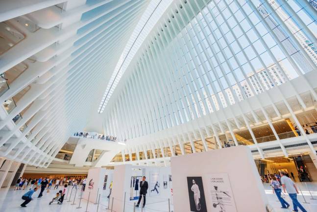 Ground zero then and now Dozens of retailers, from an Apple Store to a Banana Republic, are at the Oculus, steps from the fallen World Trade Center. Photo: Hillel Steinberg, via flickr