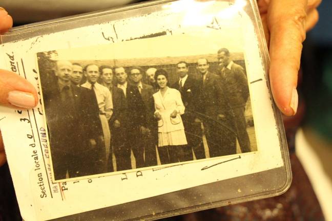 Trading on Elegance Mathilde Freund pictured in Lyon, France, on August 24, 1944, with 10 men to whom she had brought food and water every day as they hid from occupying German soldiers. Allied armies had liberated the city from German occupation that day. Photo courtesy of Mathilde Freund.