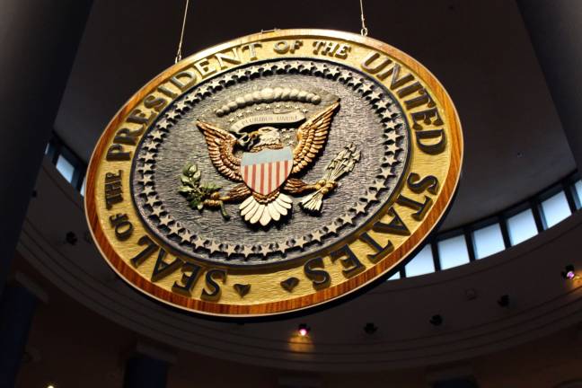 Lie or Lose Op-Ed Atlanta sculptor Charles Mitchell carved this mahogany presidential seal. It hung in the reviewing stand during President Carter's inaugural parade.