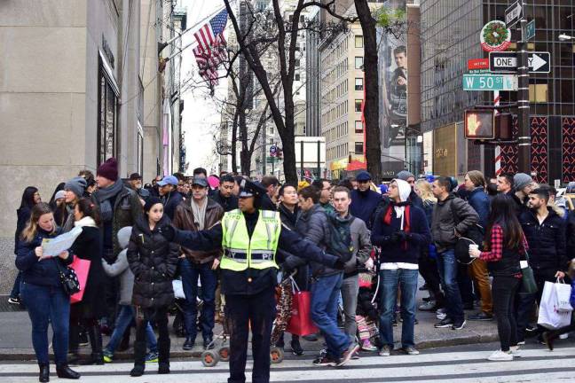 Tourist count passes 60 million, a record A throng of holiday shoppers and visitors waited for a light to change on Fifth Avenue near Rockefeller Center earlier this month. Photo: Andy Atzert, via flickr