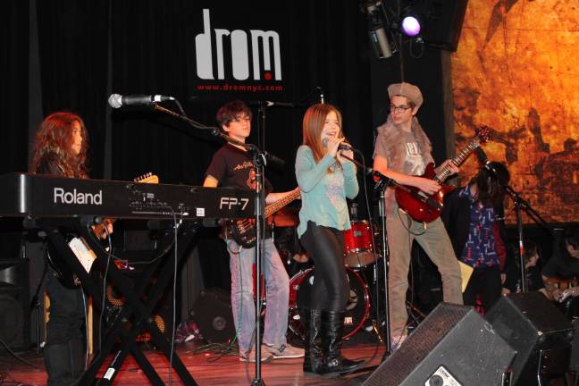 Kids Ready to Rock Music Students with after-school music program School of Rock perform Rolling Stones song "Brown Sugar" at Lower East Side music venue Drom. Photo: Gabrielle Alfiero
