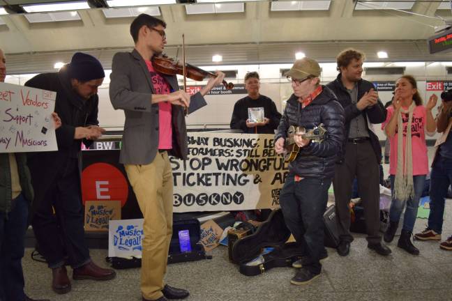 Dissonant notes in the subway Matthew Christian, playing violin, and Marc Orleans, on mandolin, performed Jan. 19 in the 72nd Street Second Avenue subway station to protest what buskers claim is unfair treatment at the hands of police.