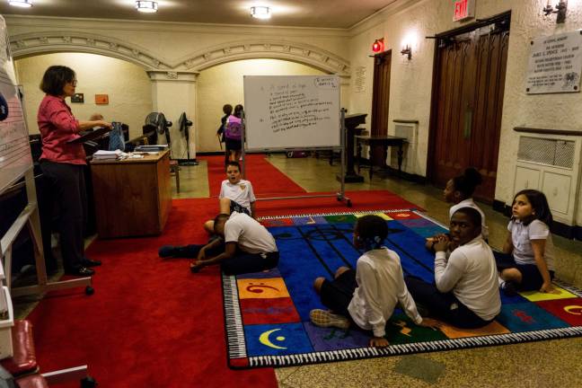 makeover for a west side building Fourth-grade students at the Alexander Robertson School wait to be dismissed by their teacher. Photo: Sophie Herbut