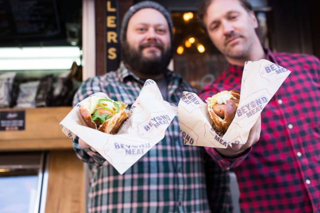 not his grandfather’s bratwurst Co-owners of Schaller’s Stube Sausage Bar Jesse Denes, left, and Jeremy Schaller with recently added vegan selections to their menu. Photo: Katie Foster