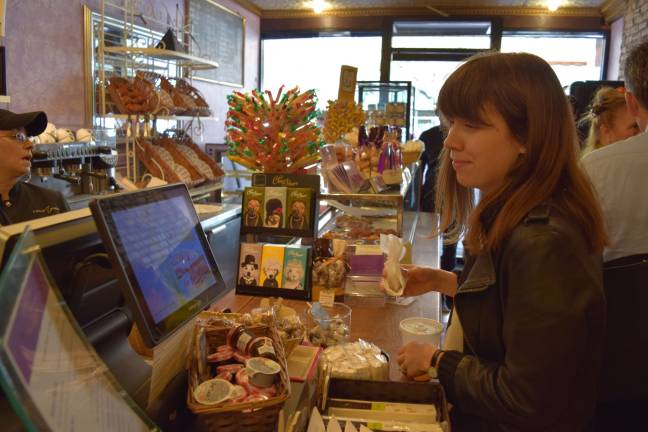 On 23rd street, community responds Rachel Van Tosh, deputy commissioner for the city’s small business services, orders at La Maison du Macaron. Photo: Genia Gould