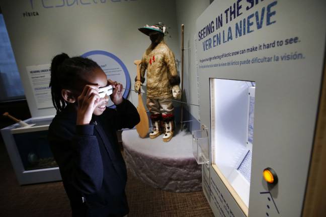 native innovation for the next generation A fifth-grade student from New York City Public School 276 tries out Native American snow goggles at the imagiNATIONS Activity Center grand opening ceremony, Thursday, May 17, 2018. Photo: Jason DeCrow/AP Images for Smithsonian's National Museum of the American Indian