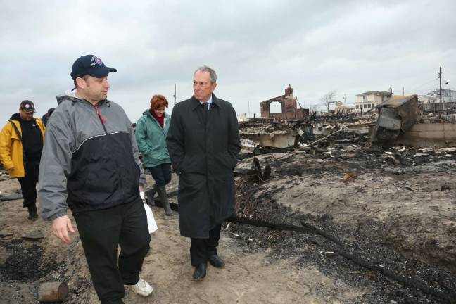 City copes with Trump approach to climate change Then-Mayor Michael Bloomberg tours a neighborhood damaged by Hurricane Sandy in 2012. Photo: Edward Reed/Mayor’s Office of Photography